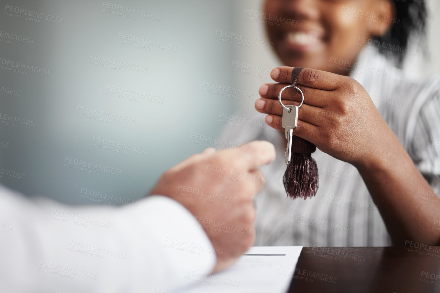 Buy stock photo Closeup of a receptionist handing over the hotel room keys to a senior patron