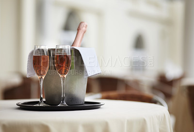 Buy stock photo Restaurant, bottle and glasses of champagne on a table for luxury service, celebration and hospitality. Hotel, wealth and wine, alcohol and drinks at a fine dining establishment for an experience