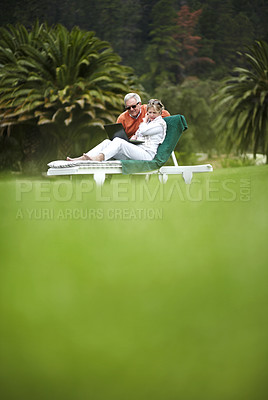 Buy stock photo Grass, garden and old couple on holiday with laptop, villa and relax on online post, email or connection. Hotel in countryside, senior man and woman in backyard with trees, social media and computer.