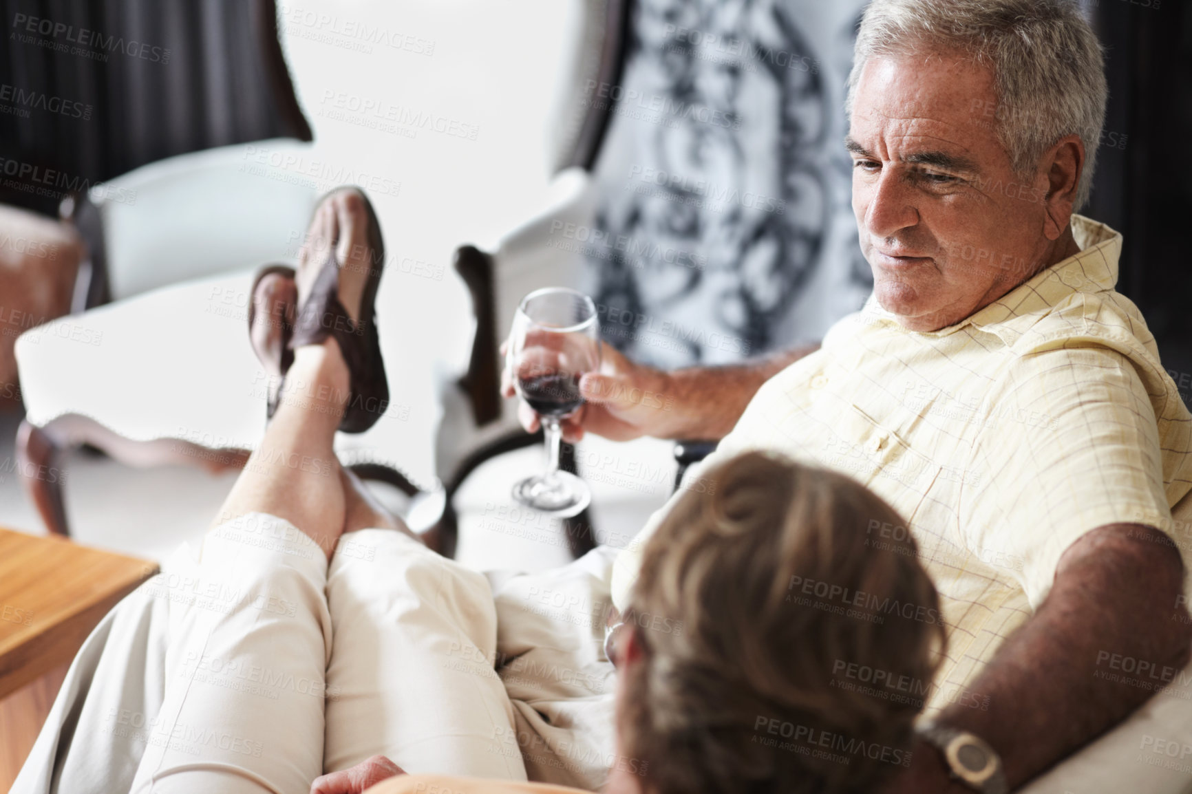 Buy stock photo Relax, love and an old couple drinking wine in their hotel room while on holiday or vacation together. Toast, sofa or retirement with a senior man and woman bonding at a luxury resort for romance