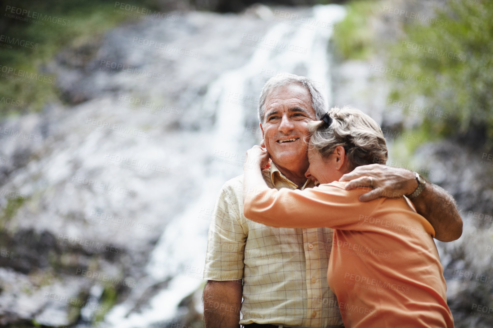 Buy stock photo Nature, love and senior couple hug, funny or retirement with relationship, romantic or loving together. Outdoor, old woman or elderly man embrace, natural or laughing with support, bonding or romance