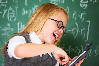 Buy stock photo child, student and calculator by chalkboard for happy education, learning and problem solving or solution. Smart girl or child with glasses and excited for school, typing numbers or math in classroom