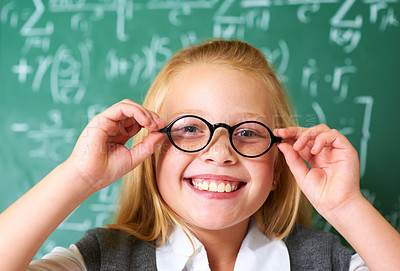Buy stock photo Portrait of a cute blonde girl adjusting her glasses in class