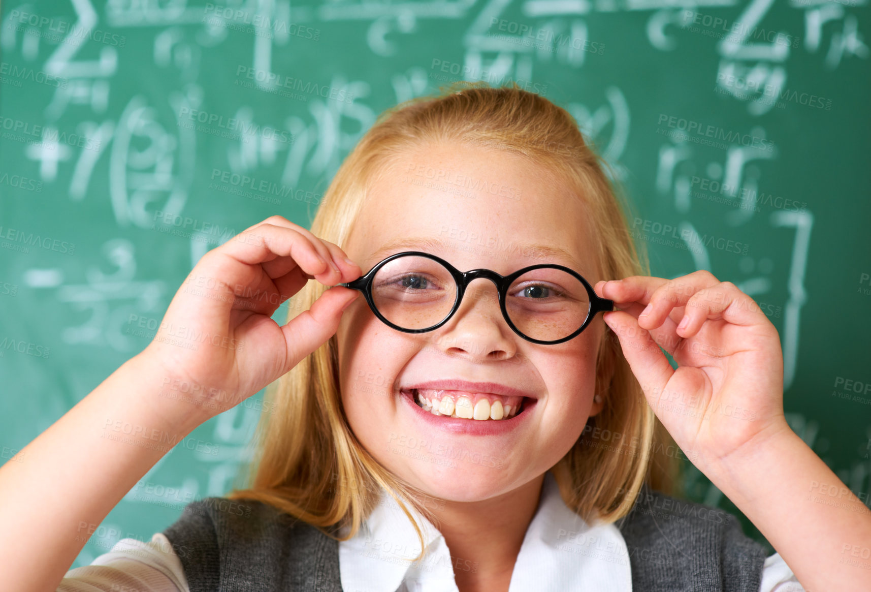 Buy stock photo Portrait of a cute blonde girl adjusting her glasses in class