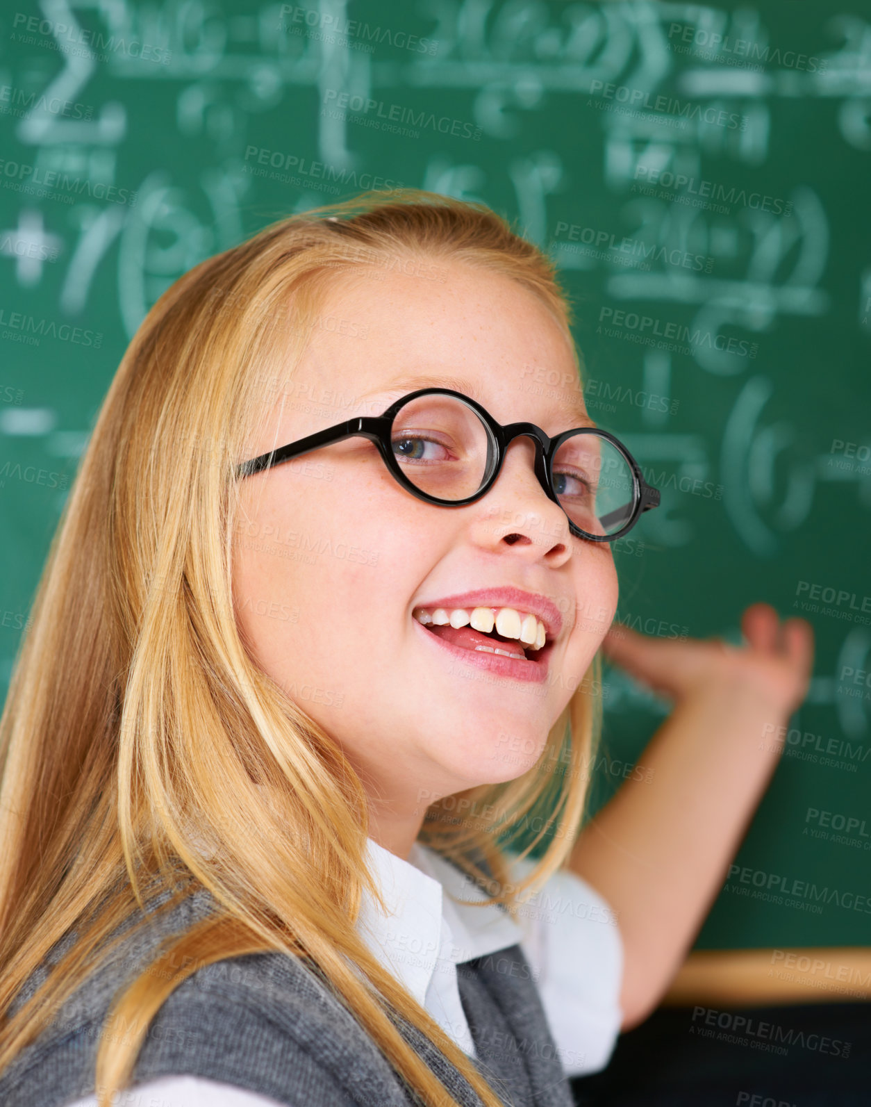 Buy stock photo Smile, portrait and child student in classroom with idea, solution or brainstorming facial expression. Happy, education and young girl kid with glasses for learning or planning with board in school.