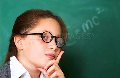 Buy stock photo Portrait of student, nerd and kid by chalkboard in class for learning knowledge, education and study math on mockup space. Face, glasses and geek at school, girl or cute child in classroom in Spain