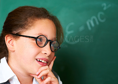 Buy stock photo Thinking, idea and child student in classroom with idea, solution or brainstorming facial expression. Smile, education and young girl kid with glasses for learning or planning with board in school.