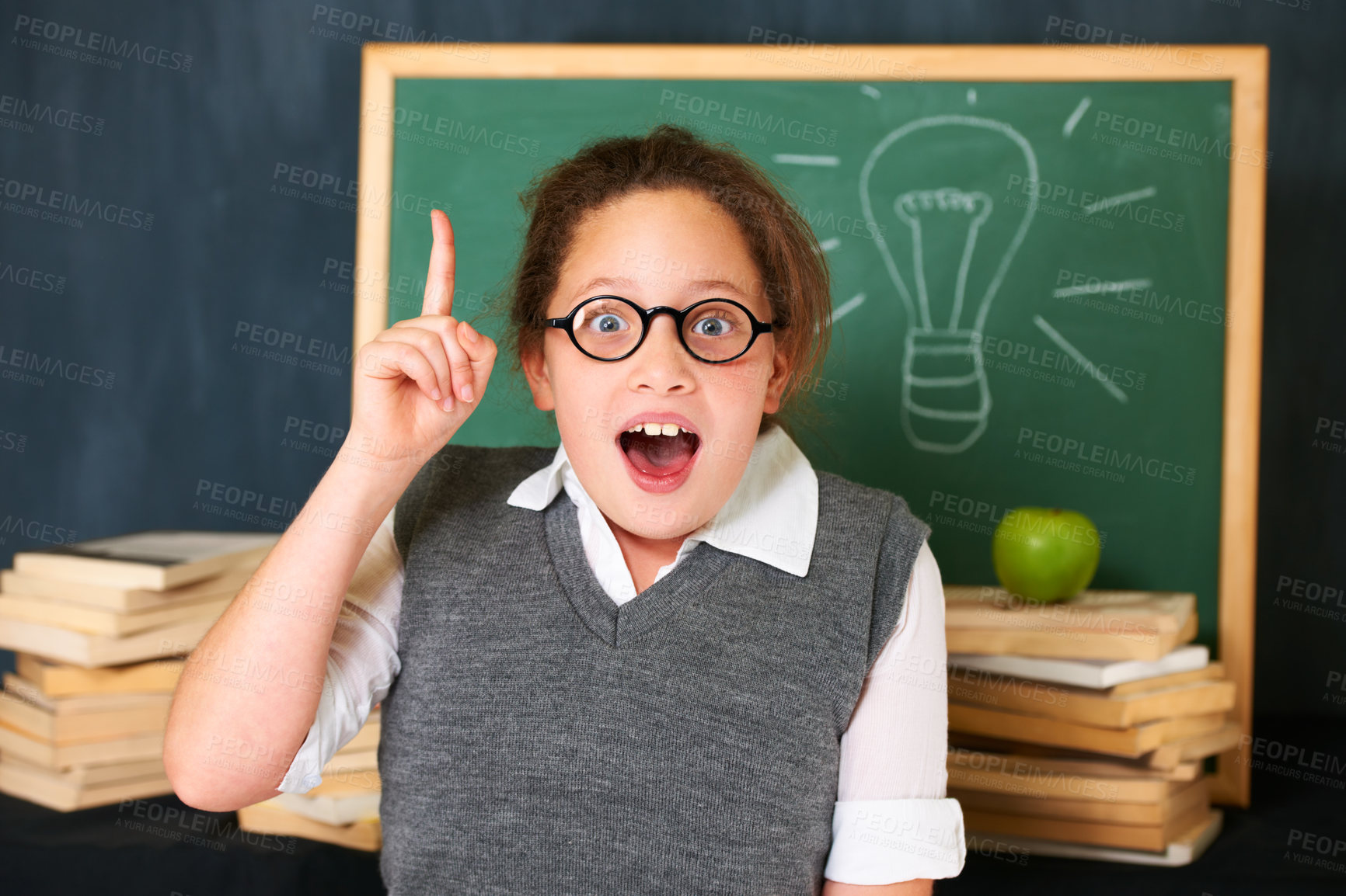 Buy stock photo Solution, idea and portrait of student with light bulb on board for plan, decision or brainstorm in classroom. Education, learning and girl child with drawing for choice, vision or future in school.