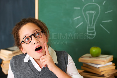Buy stock photo Child, thinking and light bulb on chalkboard for education, learning and knowledge with wow, ideas or solution in classroom. Girl, student or school kid with vision, inspiration and lightbulb doodle