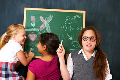 Buy stock photo Chalk, board and portrait of child student teaching friends for an education lesson or learning. Smile, happy and girl kid studying with classmates for knowledge at school or academy with scholarship