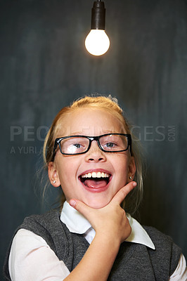 Buy stock photo Student portrait, girl and lightbulb for solution, learning and wow, surprise or excited for future, ideas and knowledge in school. Child or kid with light bulb, emoji and black chalkboard for vision