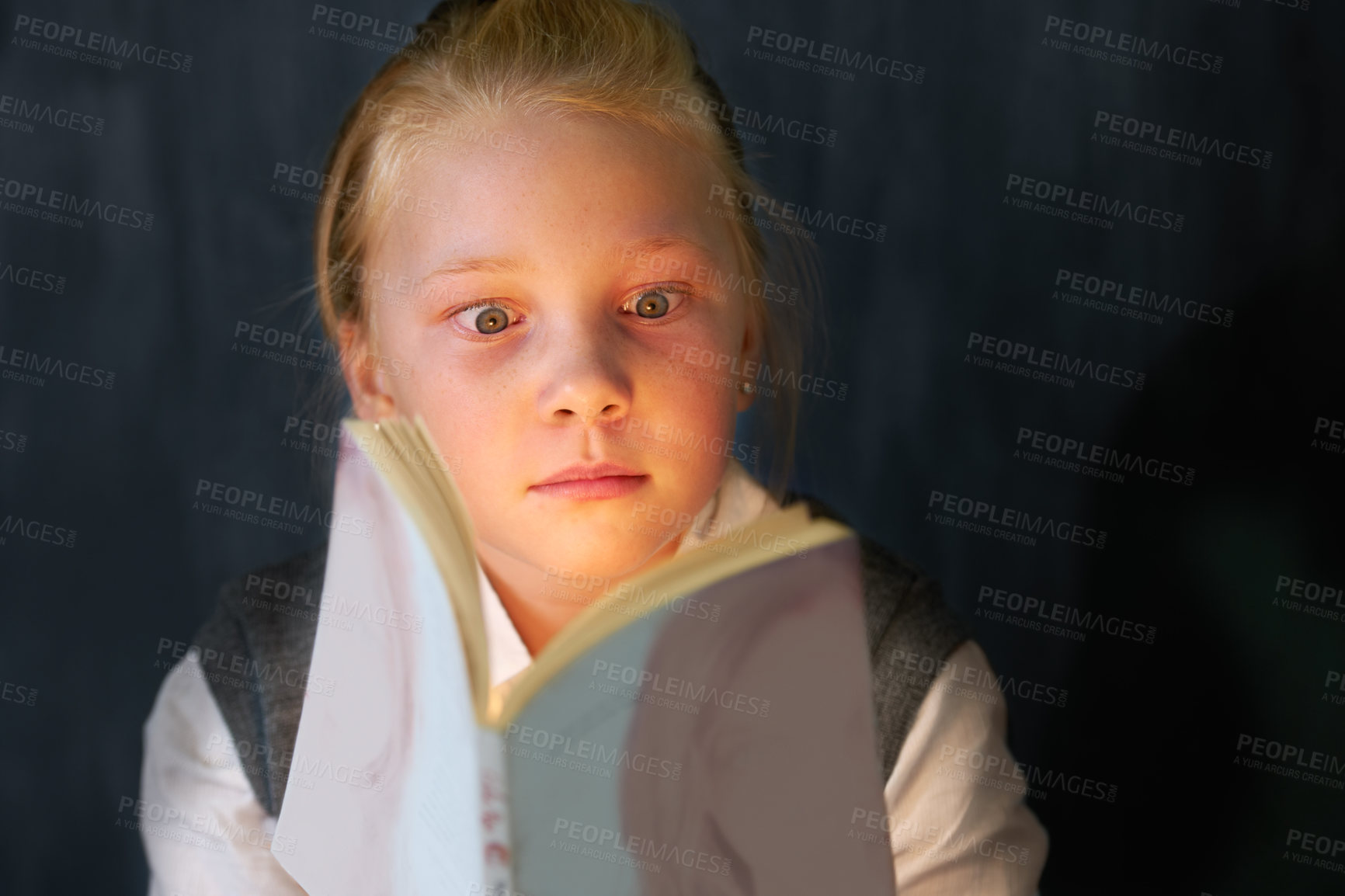 Buy stock photo Surprise, reading and child student with a book in the classroom for education, learning or knowledge. Study, nerd and young girl kid enjoying a story or novel with shock face at school or academy.