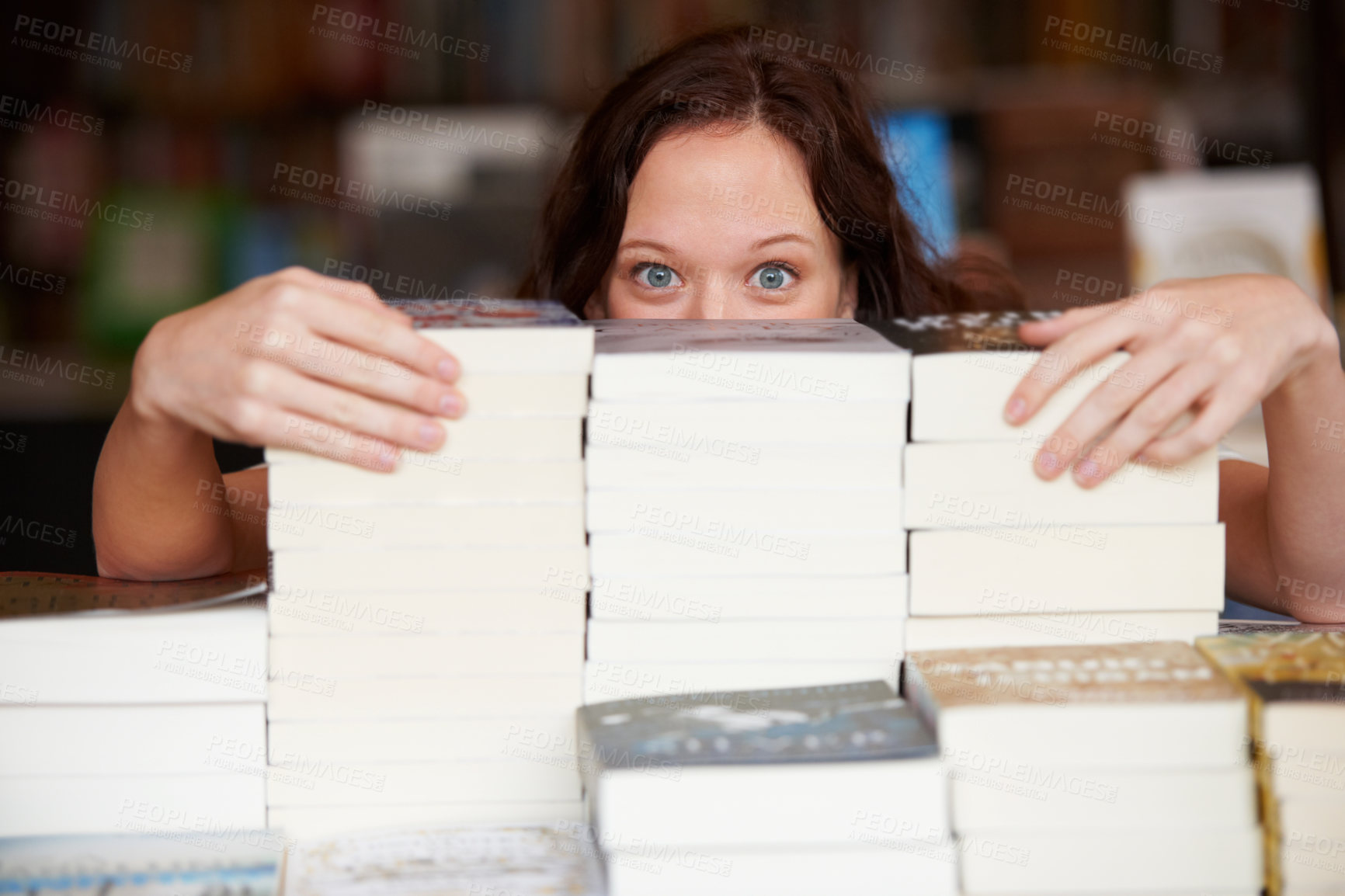 Buy stock photo Woman, bookstore and stack on table in portrait with hidden face for discount, sales and promotion. Entrepreneur, library and mystery for retail deal, literature and knowledge for learning in shop