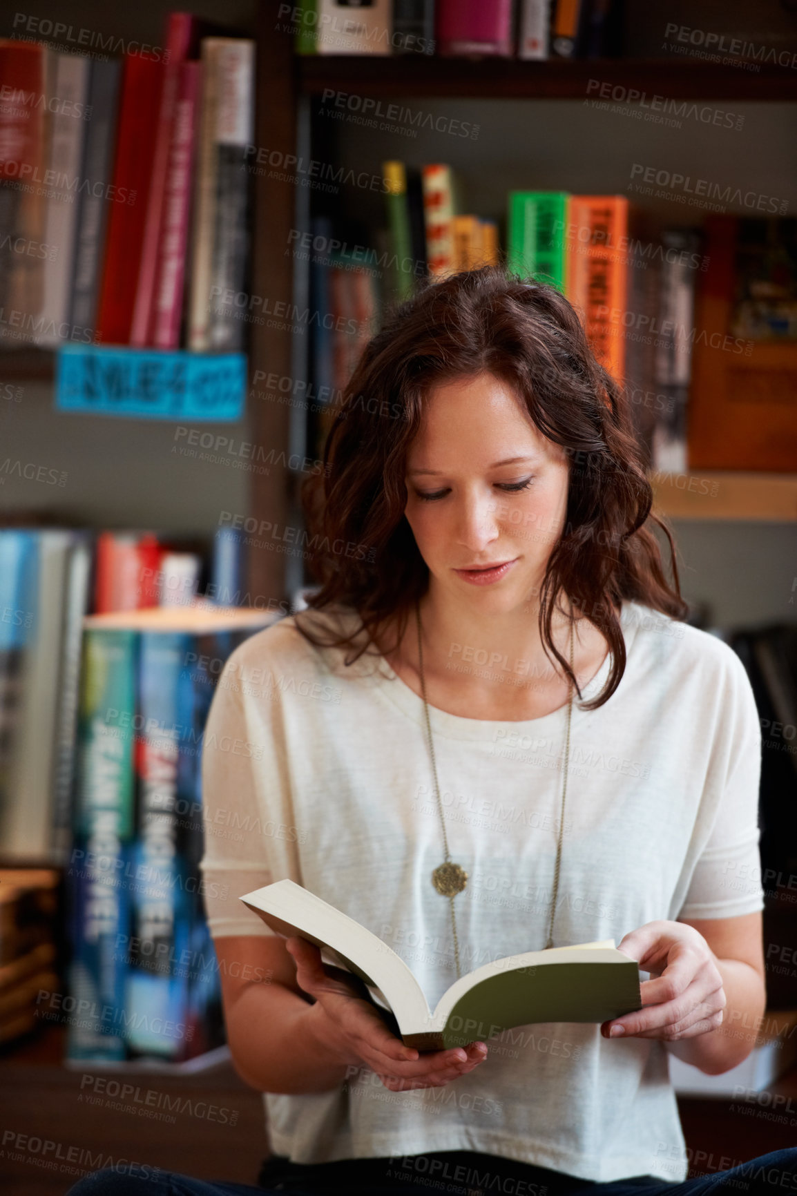 Buy stock photo Woman, book and reading in a store, library or bookstore customer and student with a novel to buy, read or study. Girl, bookshelf and studying books for college, university or research information