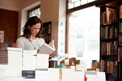 Buy stock photo Woman, books and reading in a store, library or bookstore customer and choosing a novel to buy, read or study. Girl, bookshelf and studying a book for college, university or research information