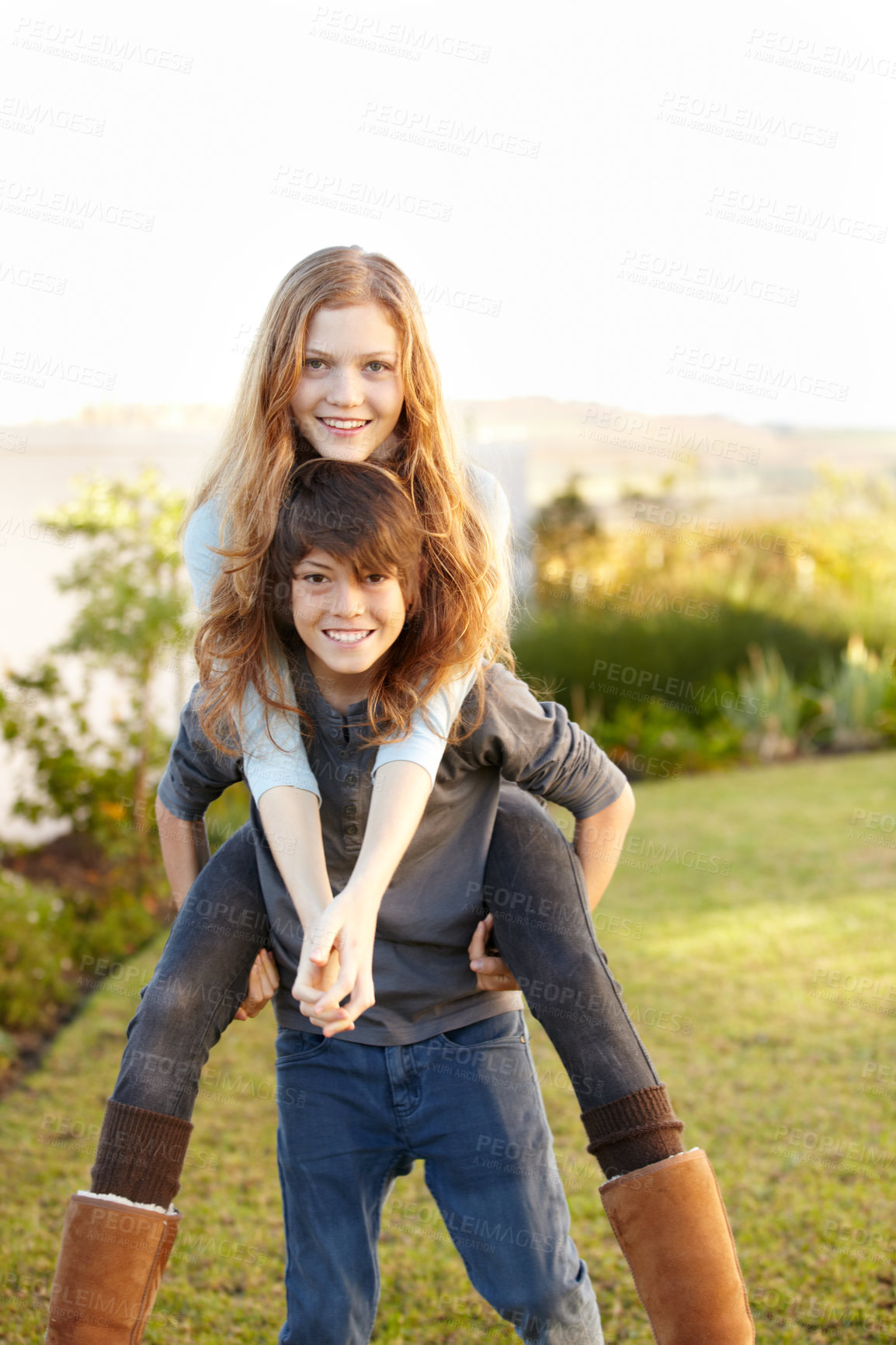 Buy stock photo Boy, girl and portrait with piggy ride in the outdoor with happiness or playful summer.  Happy, brother and embrace sister in garden with hug or back for bond or love with sunshine on weekend.