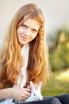 Buy stock photo Girl, portrait and rabbit smile outdoor for pet love connection, bonding or happy play. Female teenager, face or bunny in backyard for animal trust care or sunny grass park, fur child or fun together