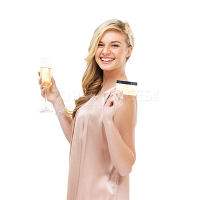 Buy stock photo Portrait of a gorgeous young blonde woman holding up her credit card in one hand and a glass of champagne in the other