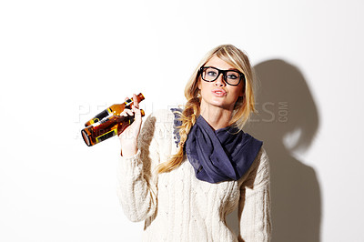 Buy stock photo Portrait, beer and a glass bottle with a woman drinking in studio on a mockup white background. Party, event or alcohol with a young drunk girl enjoying a beverage for celebration or to relax
