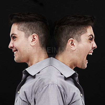 Buy stock photo Studio shot of a young man showing two sides of his personality