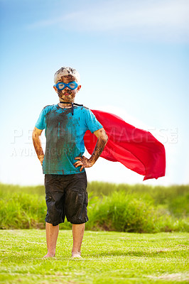 Buy stock photo Portrait of a muddy little boy dressed up like a superhero