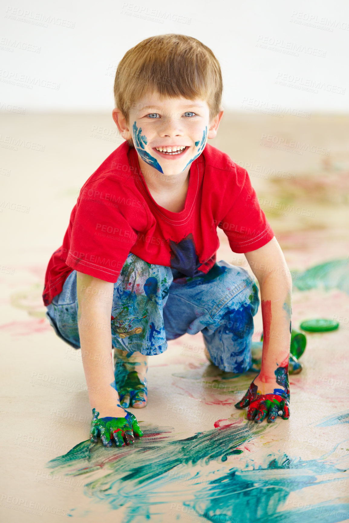 Buy stock photo Portrait, smile and a boy painting on the floor of a studio for creative expression or education at school. Art, paint and an excited young child looking happy with his messy artistic creativity