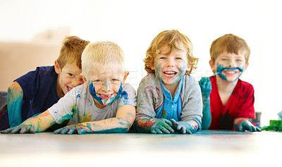 Buy stock photo Portrait of four cute little boys covered in paint