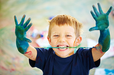 Buy stock photo A little boy covered in paint