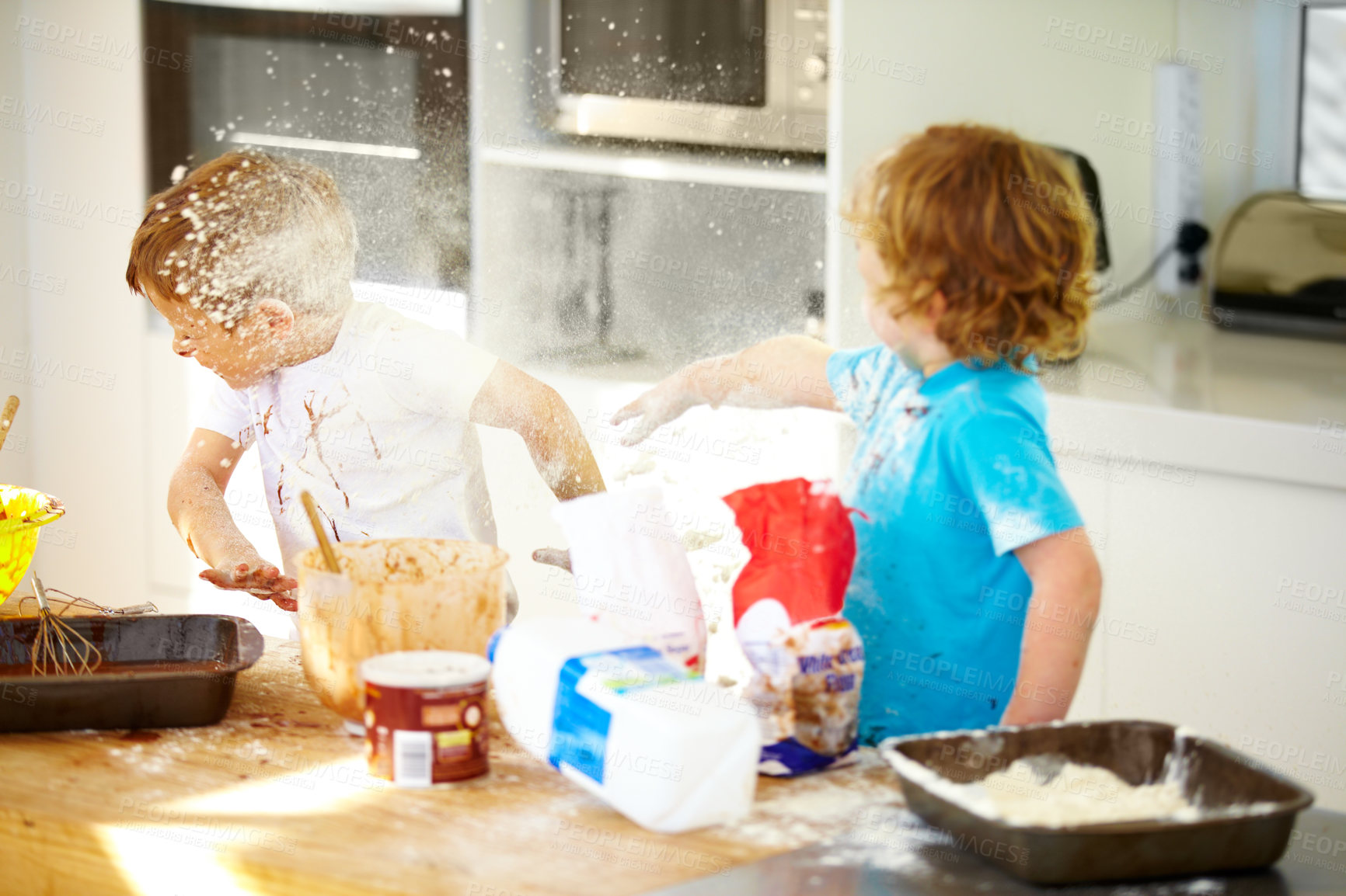 Buy stock photo Brother, baking and flour with children fighting in the kitchen while making a mess of their home together. Cooking, recipe and ingredients with boy kids arguing about instructions in a house