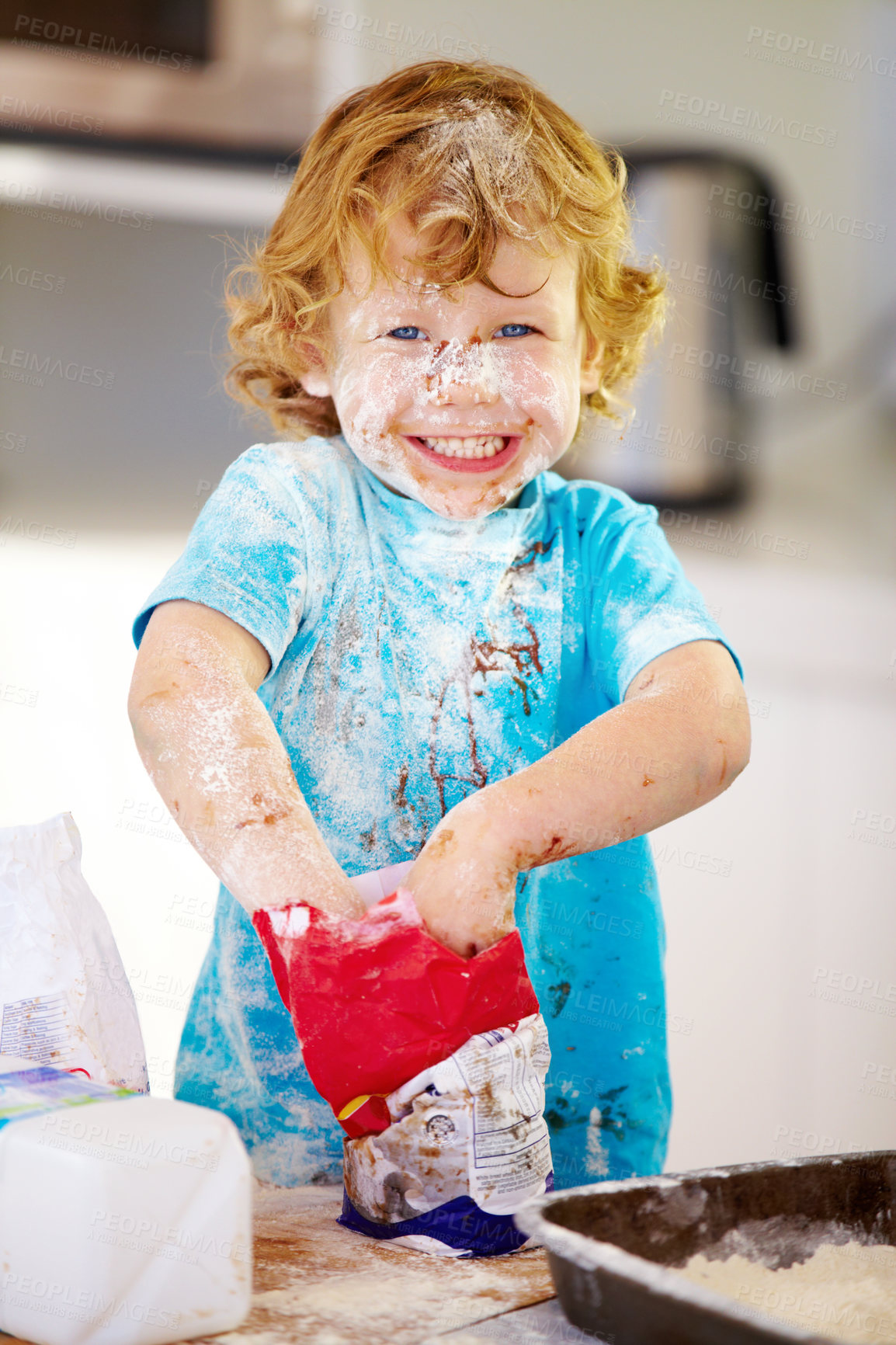 Buy stock photo A little boy covered in dough and flour