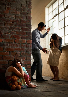Buy stock photo Little girl huddled over while her father abuses her mother nearby