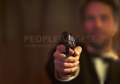 Buy stock photo View of a man holding a gun and pointing at you