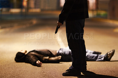 Buy stock photo Man lying on the ground after being shot by a gun-wielding criminal