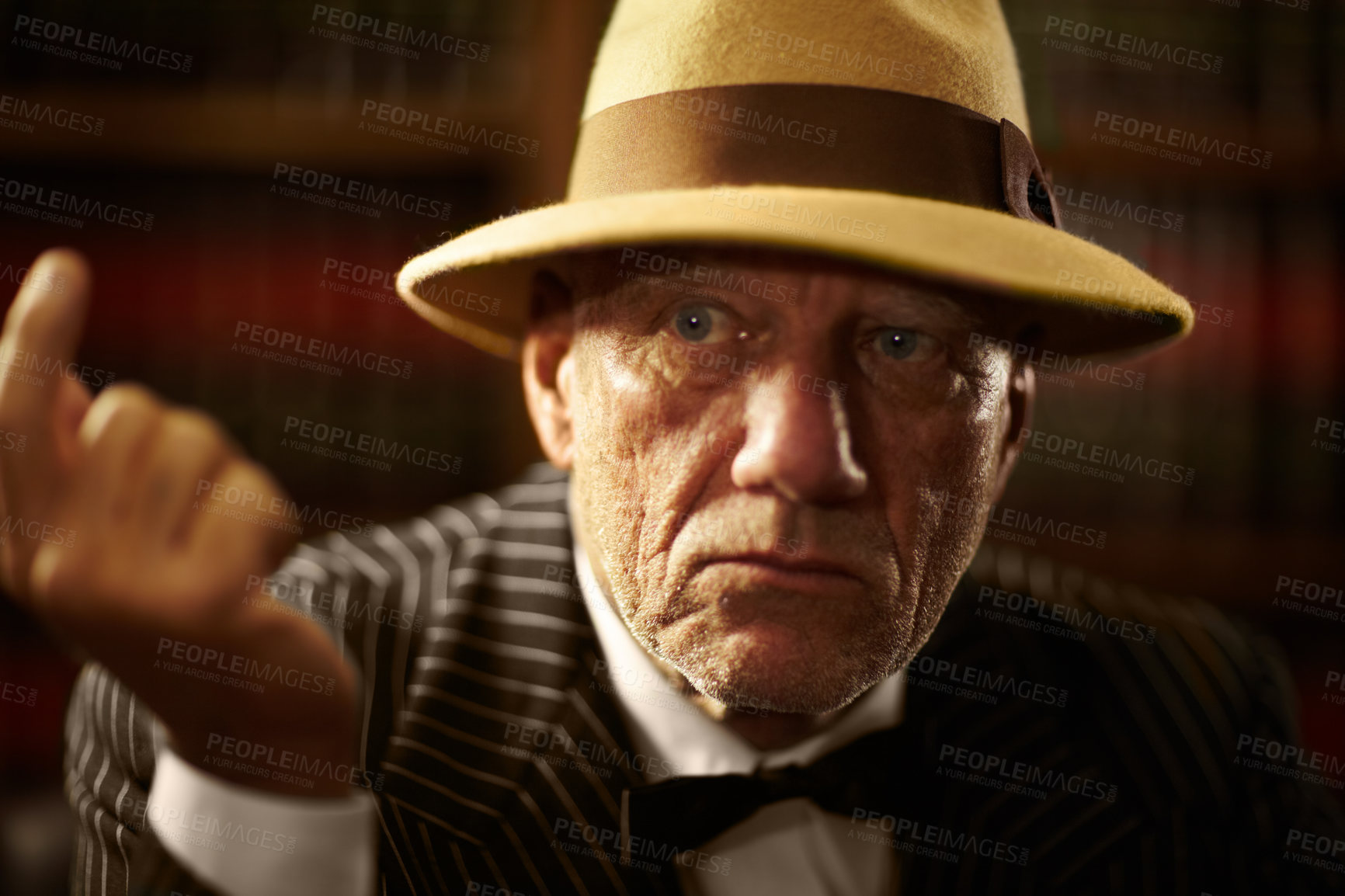 Buy stock photo Mature, mafia and boss with serious look on face with fearless threat, power and reputation for organized crime. Elderly person, mob and gangster for vintage fashion, suit and bowtie in space
