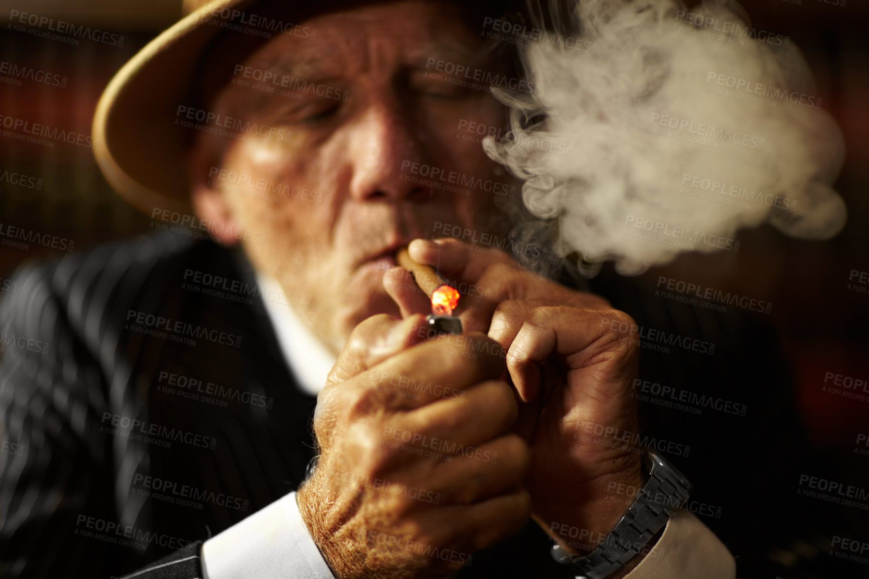 Buy stock photo Mature, man and cigarette with lighter for smoking to relax in space. Elderly person, mob boss or gangster with suit, hat and serious face for habit, hand and puff for meeting in criminal activity