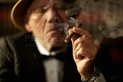 Buy stock photo Old man, smoking and cigarette in hand with smoke and crime boss of mob with a decision. Gangster, face and senior person with vintage cigar in mafia or country club with luxury, vice or habit 
