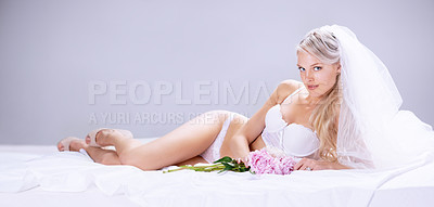Buy stock photo Portrait, sexy and bride with lingerie, luxury and happiness against a grey studio background. Face, female person and happy woman with underwear, flowers and honeymoon with joy, bedroom and beauty