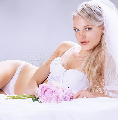Buy stock photo Portrait, woman and bride with flowers, lingerie and beauty with intimacy on a white studio background. Person, model and girl with a bouquet, underwear and veil with plants, luxury and marriage