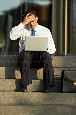 Buy stock photo Laptop, outdoor and business man stress, worry and sad for job fail, online mistake or news, bankruptcy and financial crisis. Person headache, debt and stock market crash on city stairs and computer