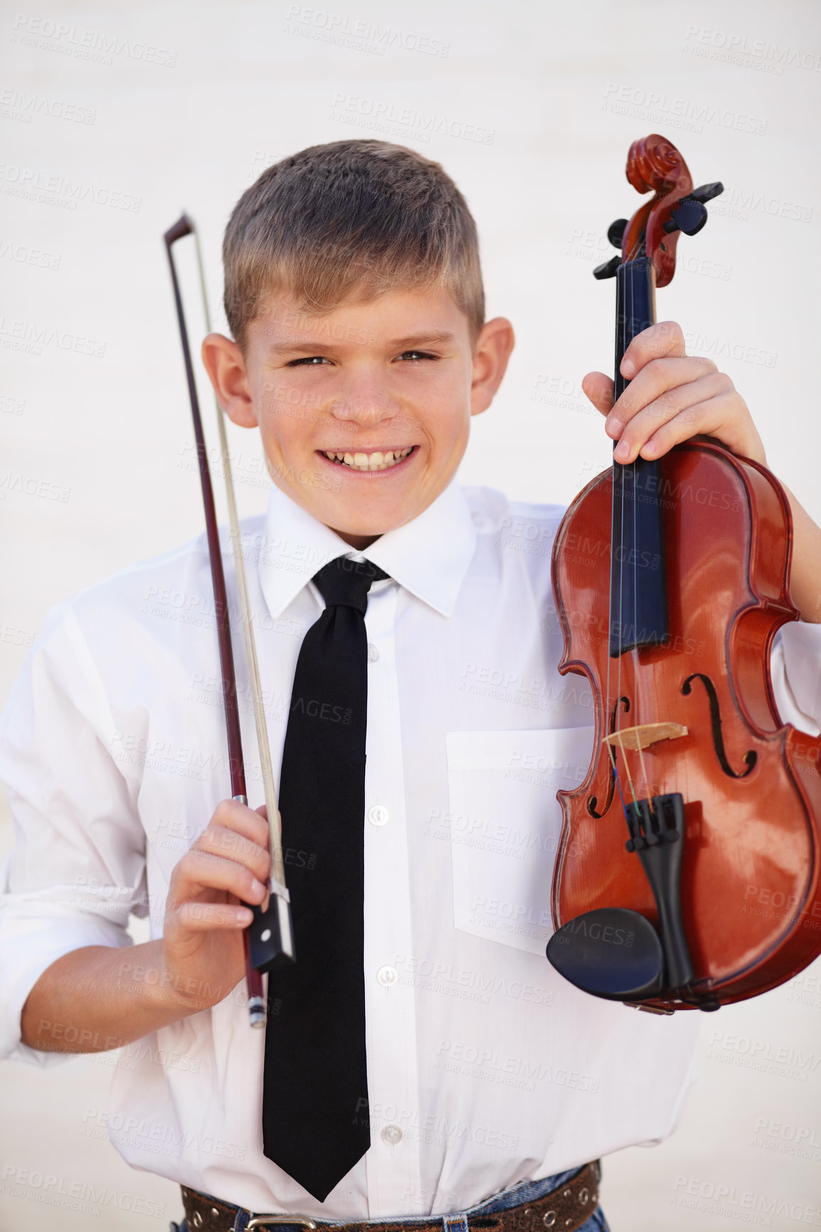 Buy stock photo Boy, portrait and smile or violin bow for music lesson, talent or learning skill practice. Male person, school child or white background or string instrument hobby or concert, orchestra or listening