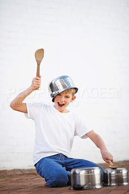 Buy stock photo Pots, drums and child with smile in home with creative noise, playing audio and young musician with sound. Music, portrait and inspiration, boy with pans in performance and talent show for children.