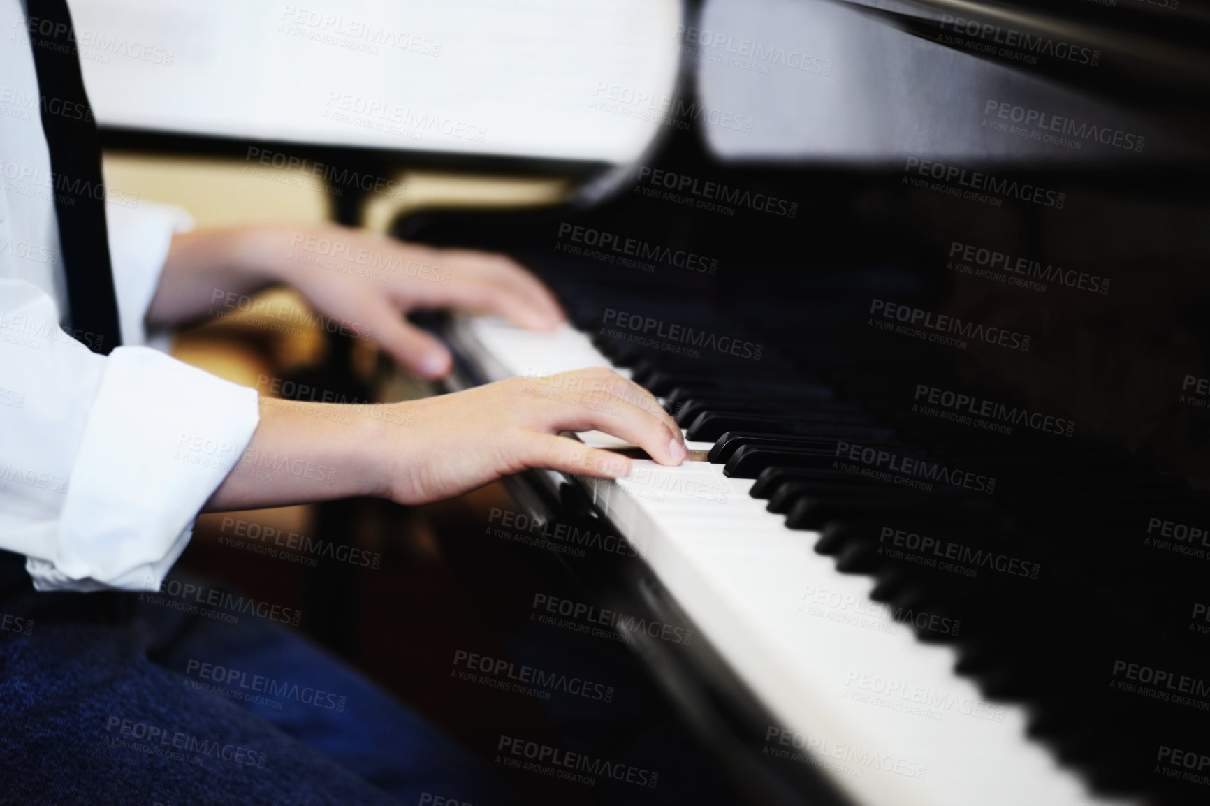 Buy stock photo Boy, hands and piano or key closeup for music talent development, skill class or performance practice. Male person, fingers and youth play instrument for sound creativity learning, hobby or band show