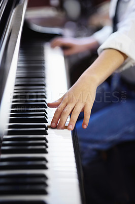 Buy stock photo Child, piano and hands on keyboard, fun and learning with attention, musician and enjoy. Talent, creativity and passion with maestro, play and instrument for musical, boy and practice concentration
