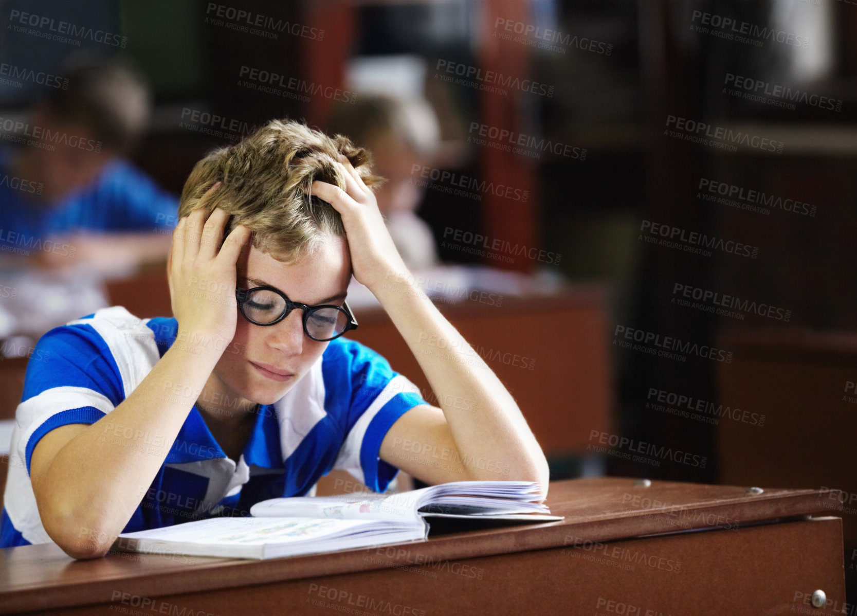 Buy stock photo Young boy feeling overcome with boredom in the classroom