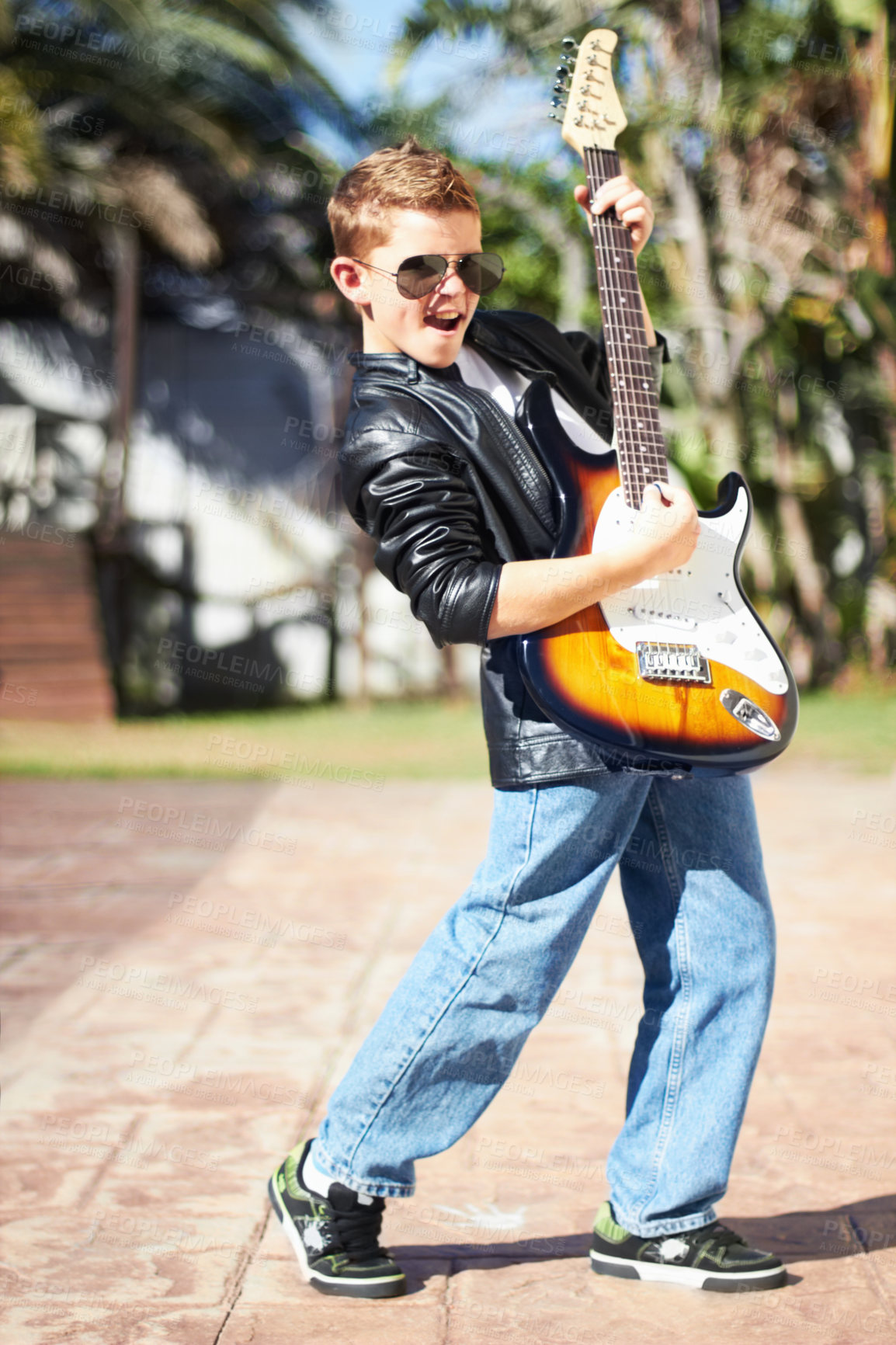 Buy stock photo Child, guitar or music as guitarist, fun or confident with attitude, musician or teen. Outdoor, sunglasses or creative with singer, play or rock for musical, boy or rockstar with talent, happy or kid