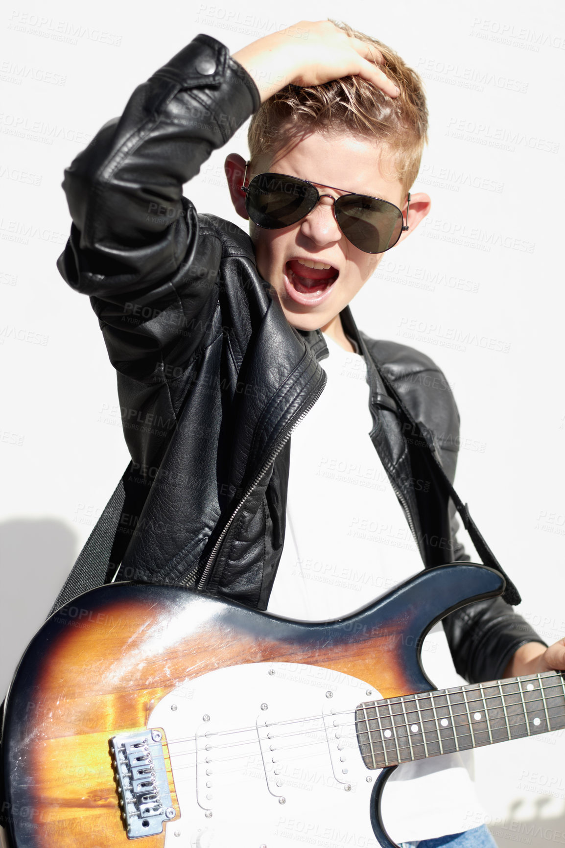 Buy stock photo Rock, portrait and child with guitar for creative sound, playing audio and cool young musician in sunglasses. Music, art and boy in performance, talent show for hipster children and white background.