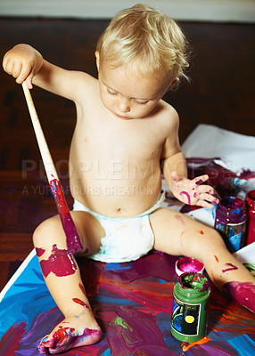 Buy stock photo Creative, painting and baby on floor with mess for child development, fun and learning. Childhood, paint and young kid with colors for creativity, artwork and education for motor skills in home