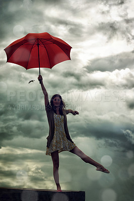 Buy stock photo Woman, balance and umbrella on rooftop for weather, adventure and freedom on trip, sky and insurance. Female person, vacation and security for getaway, peace and ballet pose on holiday to Croatia
