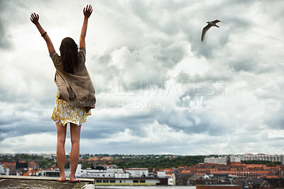 Buy stock photo Woman, arms raised and travel on rooftop, adventure and freedom on trip to Croatia, cityscape and sky. Female person, vacation and relax or positive for getaway, energy and stretching in holiday