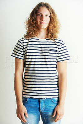 Buy stock photo Young man with curly long hair standing by himself